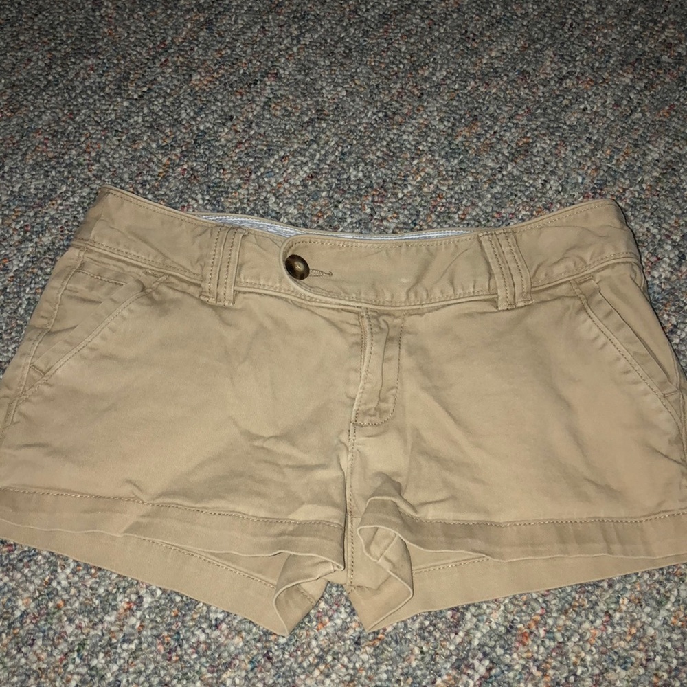 Tan red camel shorts.